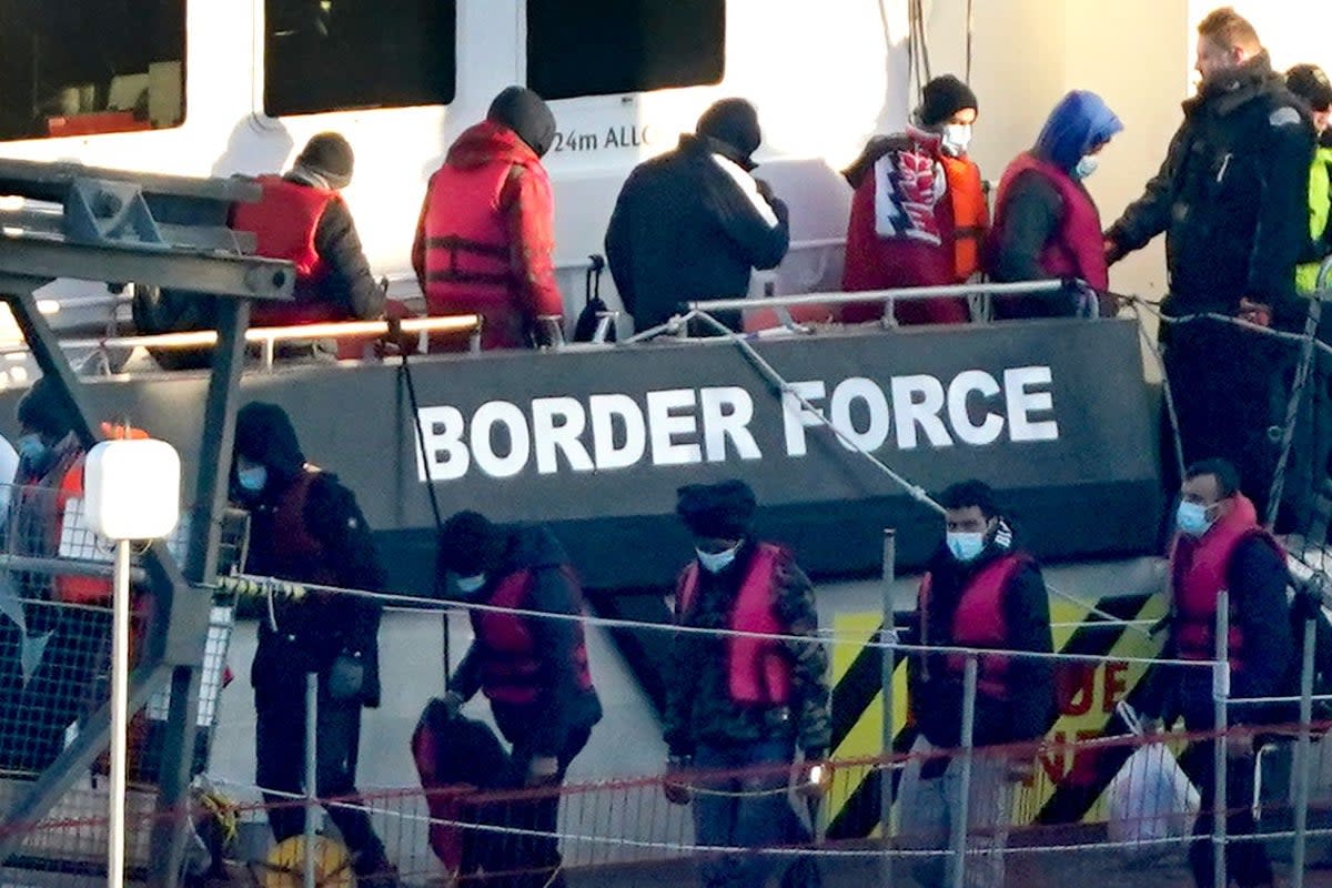 A group of people thought to be migrants are brought in to Dover on a Border Force vessel (Gareth Fuller / PA)