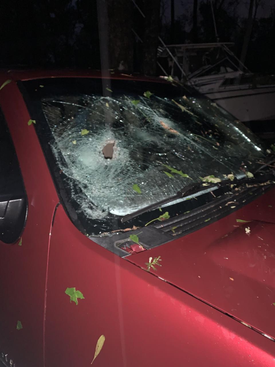 A large branch falls onto a car on Johns Island off of Chisolm Road; occurred 7:45 p.m.