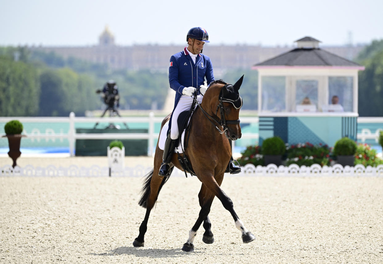 France's Alexandre Ayache with horse Jolene competes in the equestrian's team dressage during the Paris 2024 Olympic Games at the Chateau de Versailles, in Versailles, in the western outskirts of Paris, on July 31, 2024. (John MacDougall/AFP via Getty Images)