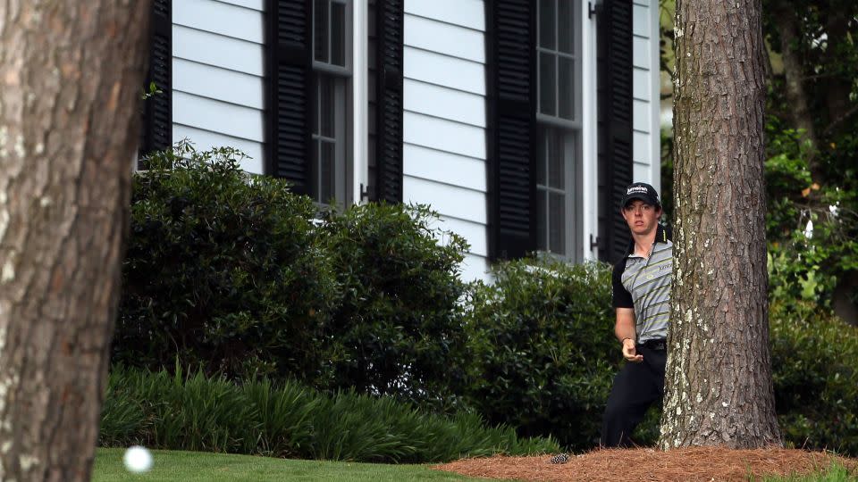 McIlroy watches his shot after his initial drive from the 10th tee put him close to Augusta's cabins. - Andrew Redington / Getty Images