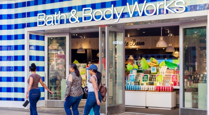 A photo of three women walking by a Bath&Body Works storefront.