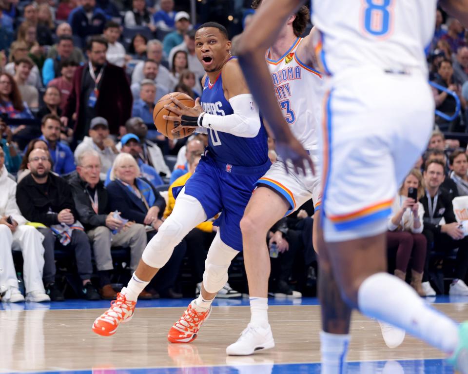 LA Clippers' Russell Westbrook (0) drives to the basket during the NBA basketball game between the Oklahoma City Thunder and the Los Angelos Clippers at Paycom Center in Oklahoma City, Thursday, Dec. 21, 2023.