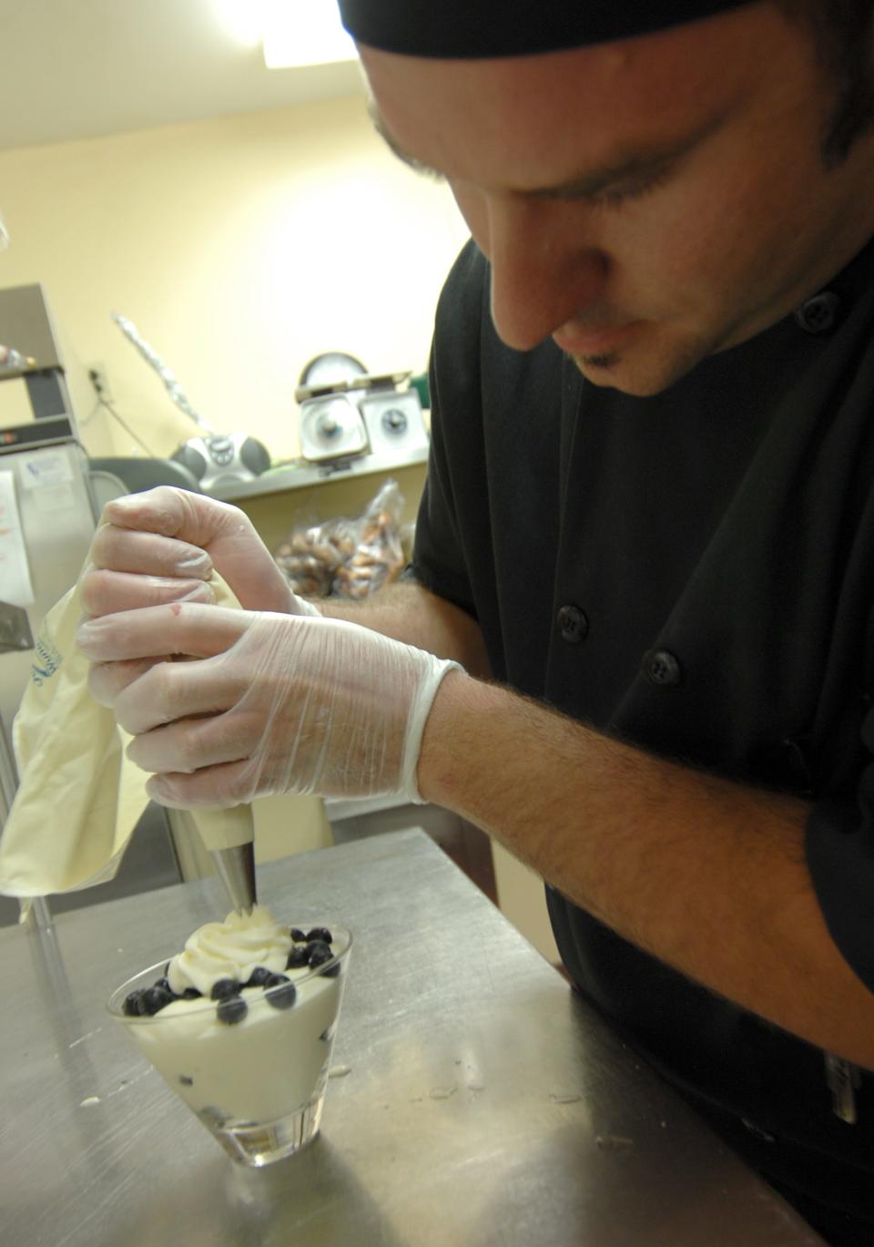 Executive Chef Travis Teska prepares a lemon mousse in July 2008 at The Wright Place on 6th in Wausau. The restaurant opened in September 2006 and operated until 2012 in the historic Ely Wright House.