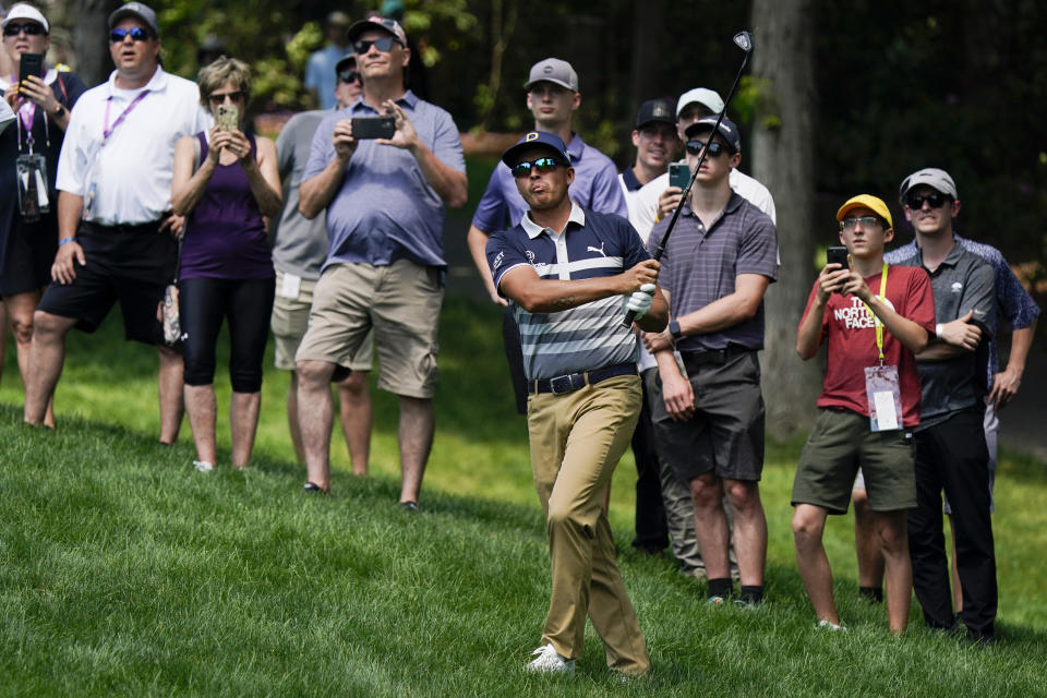 Rickie Fowler hits to the ninth green during the third round of the Memorial golf tournament, Saturday, June 5, 2021, in Dublin, Ohio. (AP Photo/Darron Cummings)