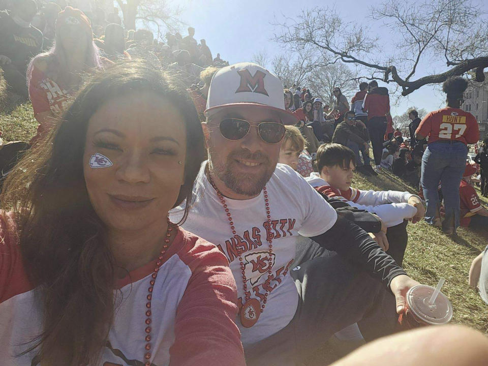 In this photo provided by Casey Filter, Casey and her husband, Trey Filter, attend the Kansas City Chiefs festivities with their 12- and 15-year-old sons, in Kansas City, Mo., Wednesday, Feb. 14, 2024. The family were walking to their car when they heard gunfire and someone yelled "Get him!" Trey tackled a man running past with a firearm, which fell to the ground before Casey secured it until police arrived. (Casey Filter via AP)