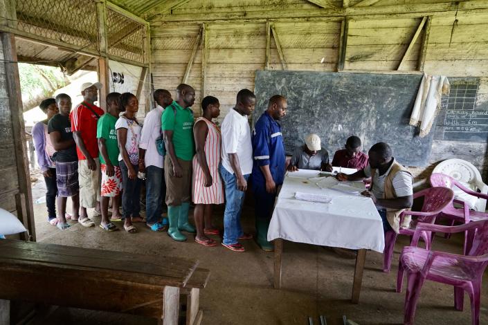 Located in a former school building, a local NGO registers locally displaced residents for humanitarian aid that arrive from new camps set up in the bush on May 11, 2019 in Buea, Cameroon. / Credit: Giles Clarke/UNOCHA via Getty Images