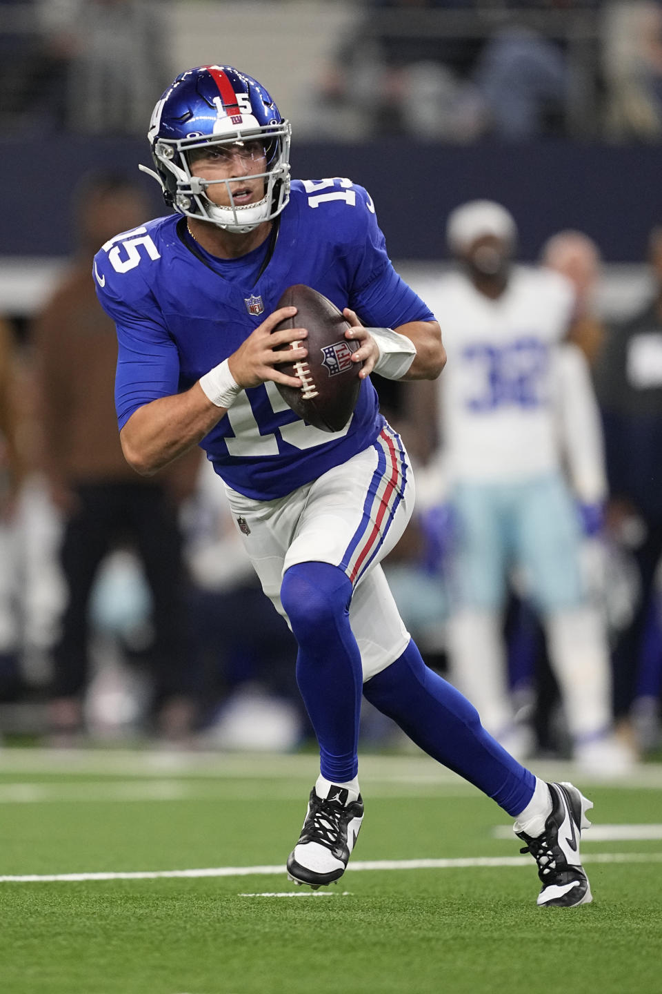 New York Giants quarterback Tommy DeVito (15) scrambles in the second half of an NFL football game against the Dallas Cowboys, Sunday, Nov. 12, 2023, in Arlington, Texas. (AP Photo/Tony Gutierrez)