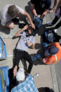 <p>CHARescue workers and medics tend to many people who were injured when a car plowed through a crowd of anti-facist counter-demonstrators marching through the downtown shopping district Aug. 12, 2017 in Charlottesville, Va. (Photo: Chip Somodevilla/Getty Images) </p>