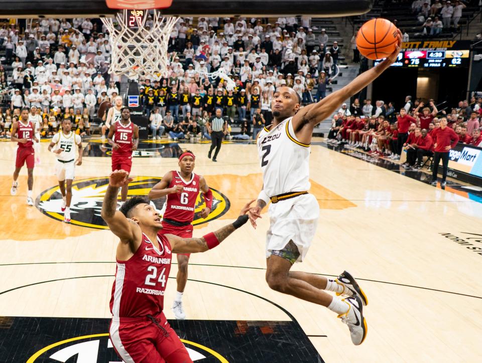 Jan 31, 2024; Columbia, Missouri, USA; Missouri Tigers guard Tamar Bates (2) shoots against Arkansas Razorbacks guard Jeremiah Davenport (24) during the second half at Mizzou Arena. Mandatory Credit: Jay Biggerstaff-USA TODAY Sports