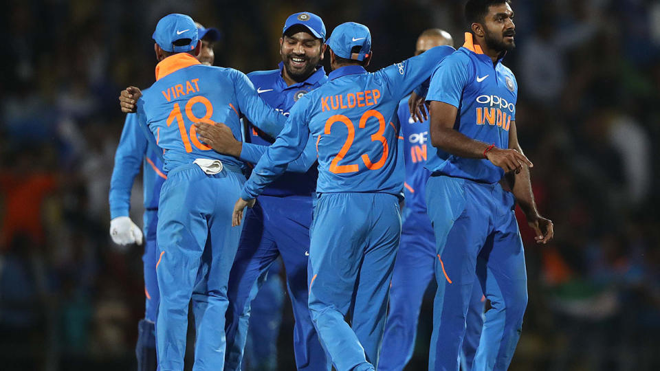 India celebrate after they defeated Australia. (Photo by Robert Cianflone/Getty Images)