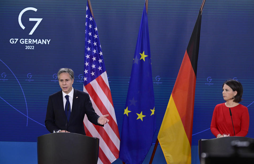 US Secretary of State Antony Blinken, left, and German Foreign Minister Annalena Baerbock, right, address the media during a joint press conference after a meeting in Berlin, Germany, Friday, June 24, 2022. (John MacDougall/Pool Photo via AP)