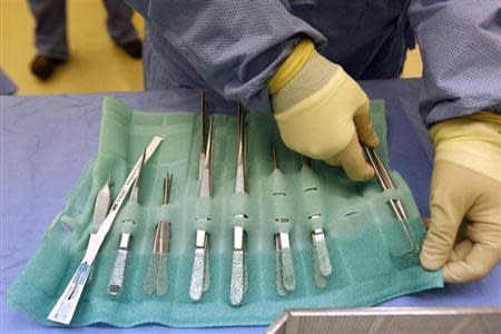 Surgical Tech Melissa Ellis prepares an OR room in the University of Mississippi Medical Center in Jackson, Mississippi October 4, 2013. REUTERS/Jonathan Bachman