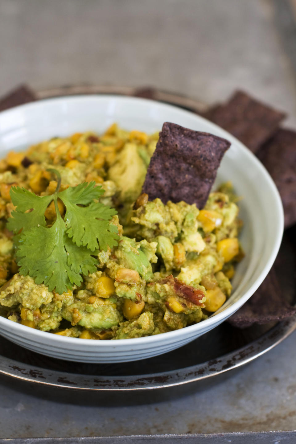 In this image taken on January 7, 2013, chipotle corn guacamole is shown served in a bowl in Concord, N.H. (AP Photo/Matthew Mead)