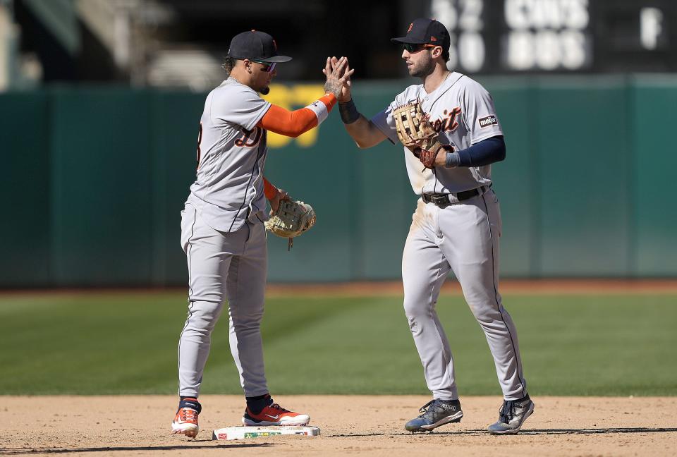 Javier Baez and Matt Vierling of the Detroit Tigers celebrate defeating the Oakland Athletics 2-0 at RingCentral Coliseum on September 24, 2023 in Oakland, California.