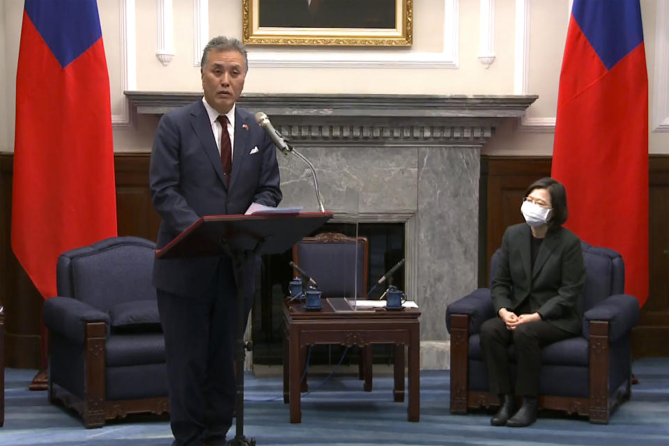 In this image made from video released by the Taiwan Presidential Office, U.S. Representative Mark Takano, left, D-Calif. speaks during a meeting with Taiwanese President Tsai Ing-wen at the Presidential Office in Taipei, Taiwan Friday, Nov. 26, 2021. Five U.S. lawmakers met with Taiwan President Tsai Friday morning in a surprise one-day visit intended to reaffirm the United States' "rock solid" support for the self-governing island. (Taiwan Presidential Office via AP)