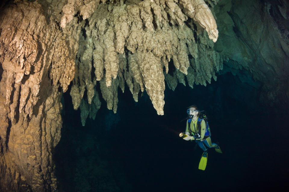 A scuba diver in a cave