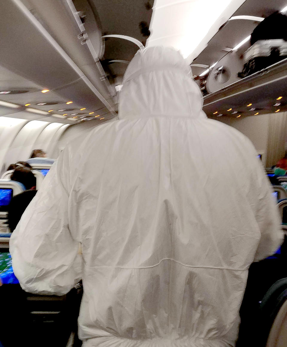 IMAGE: Quarantine officer on a plane