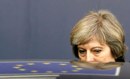 FILE PHOTO: Britain's Prime Minister Theresa May leaves a EU Summit in Brussels, Belgium December 15, 2016. REUTERS/Yves Herman/File Photo