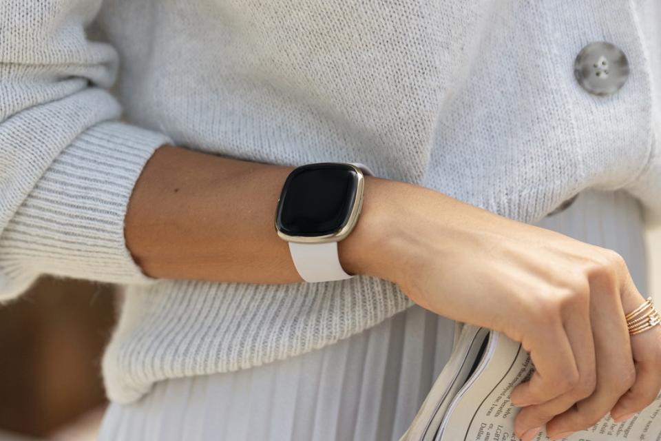 Lifestyle photo of Fitbit Sense.