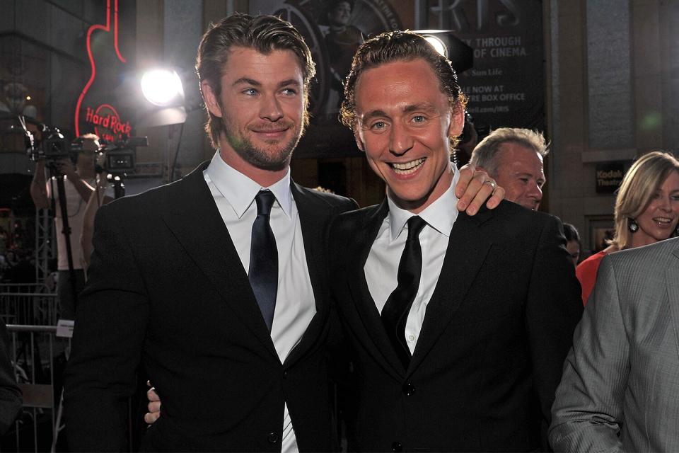 Actors Chris Hemsworth and Tom Hiddleston arrive at the Los Angeles premiere of "Thor" at the El Capitan Theatre on May 2, 2011 in Hollywood, California.