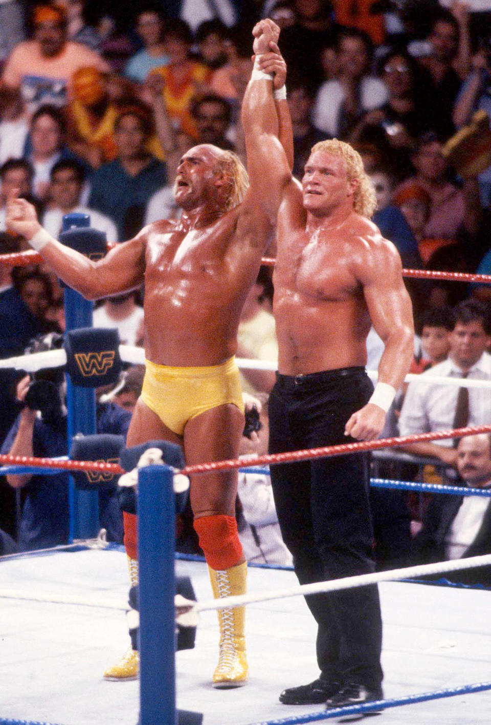 Sid Eudy and Hulk Hogan with hands raised (John Barrett / PHOTOlink / MediaPunch via AP)