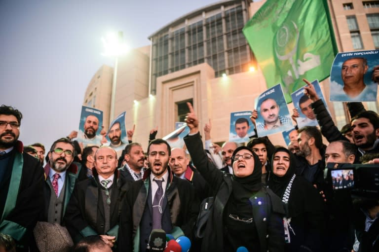 Lawyers and families hold pictures of victims and shout slogans outside the Istanbul courthouse on December 9, 2016, to protest a deadly 2010 raid by Israeli commandos on a Gaza-bound aid ship