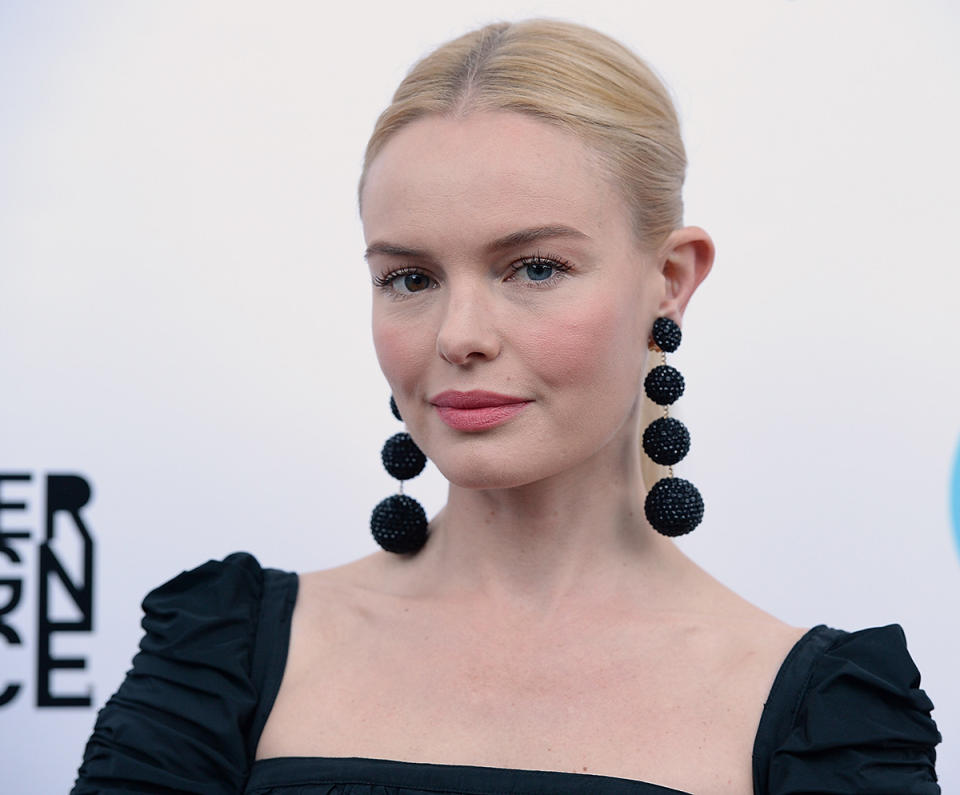 <p>Bosworth attended the 19th Annual Slavery to Freedom Gala in Los Angeles wearing a simple, center-parted updo, spidery lashes, and rosy cheeks and lips. (Photo: Getty Images) </p>