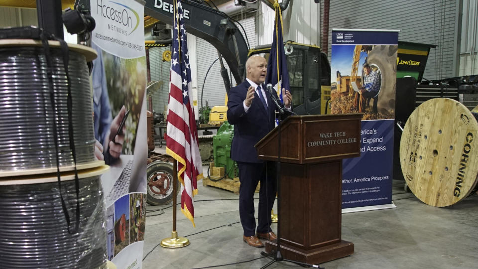 White House senior adviser Mitch Landrieu speaks in a repurposed railroad depot in Elm City, N.C., during an event to announce rural broadband funding on Thursday, Oct. 27, 2022. AccessOn Networks will receive $17.5 million to connect communities, businesses, farms and educational facilities to high-speed internet. (AP Photo/Allen G. Breed)