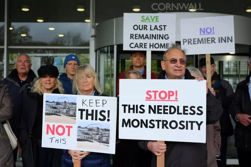 People protest outside County Hall / Lys Kernow in Truro against plans for a Premier Inn hotel in St Ives