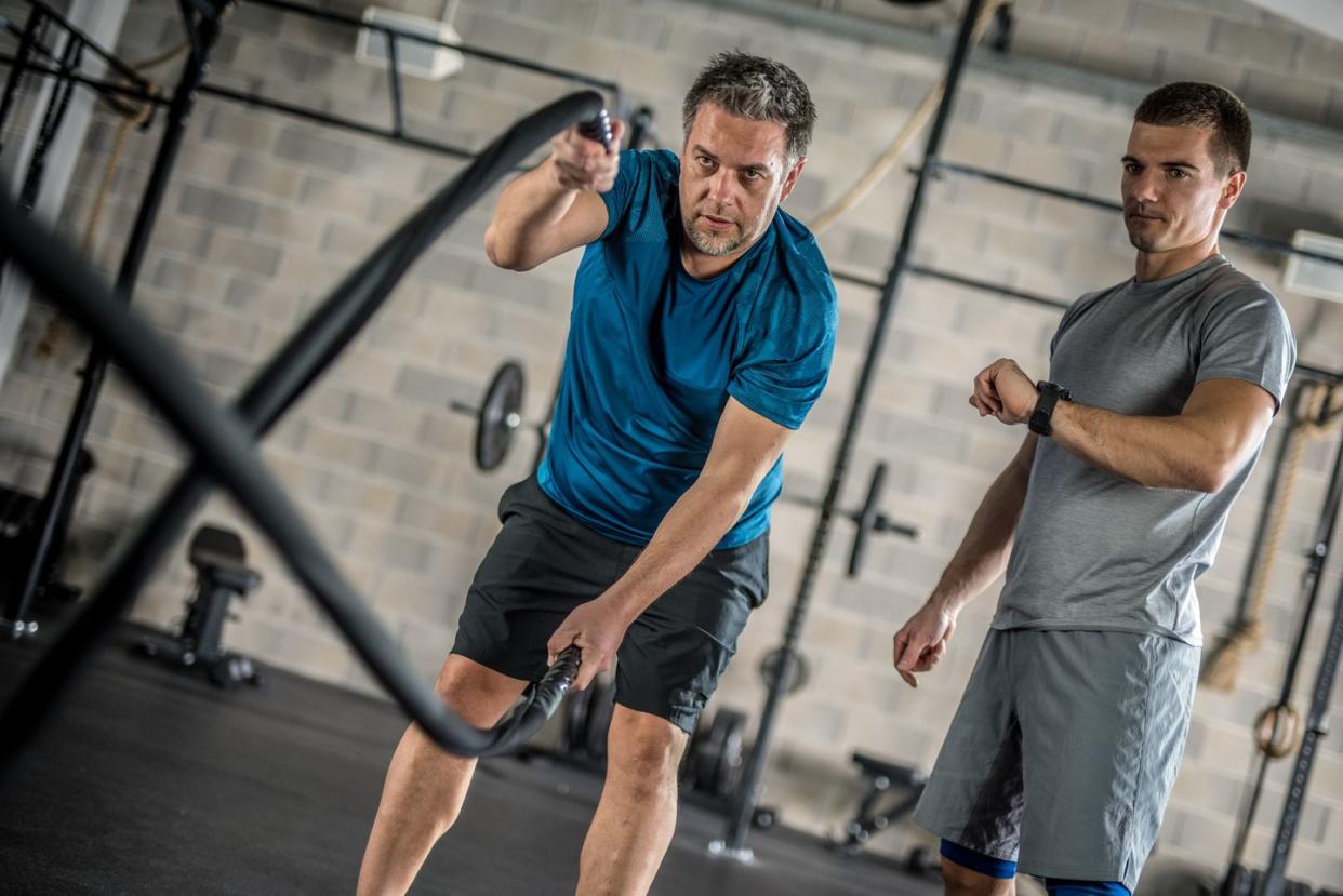 Mature man exercising in gym