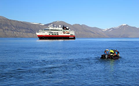 MS Fram and RIB boat in Spitsbergen - Credit: Zoels, Joerg / Hurtigruten