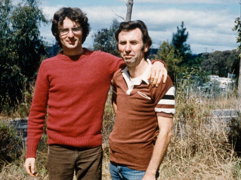 David Koresh puts his arm around Clive Doyle in 1986 during a recruiting trip to Australia.