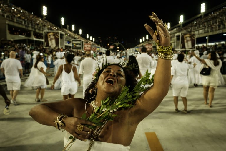 Revellers take part in the ceremony to purify the Sambadrome in preparation for the world-famous samba carnival in Rio de Janeiro, Brazil