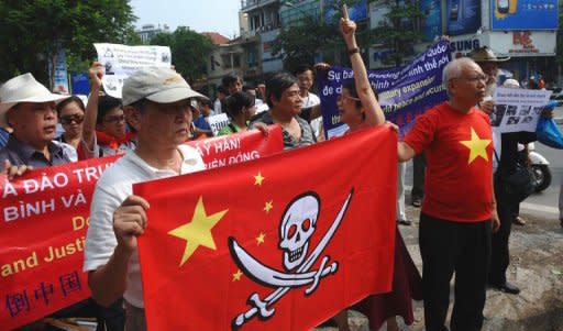 Vietnamese protestors shout anti-China slogans during a rally over tensions in the South China Sea, in a street close to the Chinese embassy in Hanoi on July 17, 2011. Vietnam has seen an unprecedented seven weeks of anti-China rallies but activists say the demonstrations essentially reveal the limits to freedom of expression in the authoritarian nation