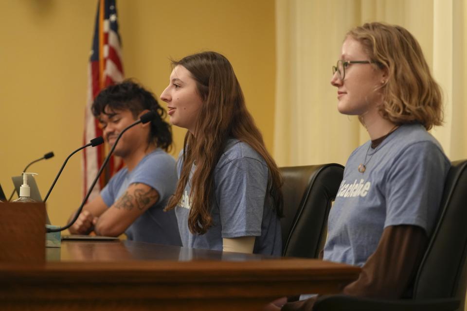 Lucia Everist, of Climate Generation, center, speaks to the Minnesota Youth Council, Tuesday, Feb. 27, 2024, in St. Paul, Minn. The advocates called on the council, a liaison between young people and state lawmakers, to support a bill requiring schools to teach more about climate change. (AP Photo/Abbie Parr)