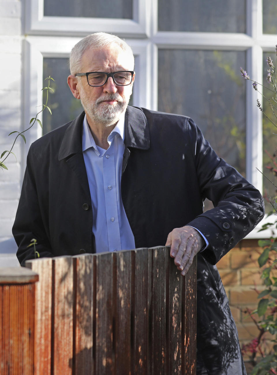 Leader of Britain's main opposition Labour Party, Jeremy Corbyn leaves his home in north London, Saturday Dec. 14, 2019. Corbyn has pledged to stand down from the party leadership following the collapse of the party vote in the recent general election and is under fire from within his own party. (Isabel Infantes/PA via AP)