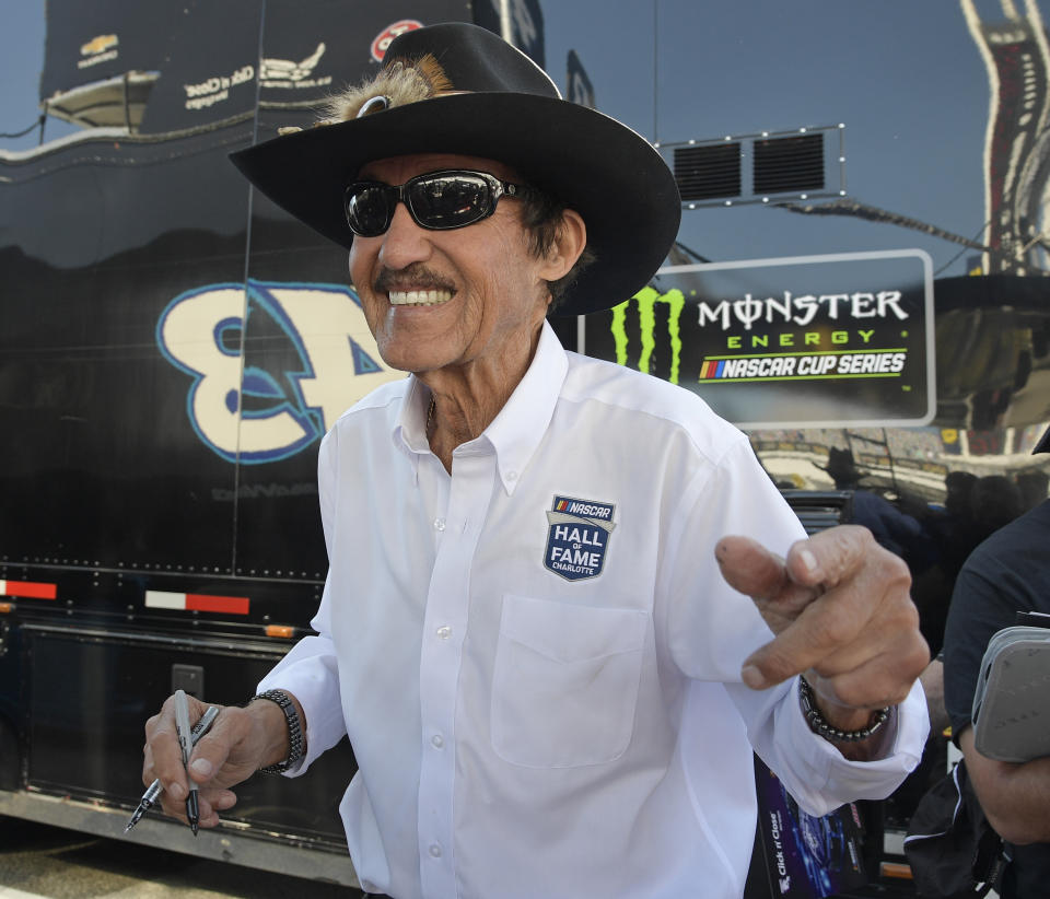 Richard Petty smiles as he signs autographs during practice for the NASCAR Daytona 500 Cup Series auto race at Daytona International Speedway in Daytona Beach, Fla., Saturday, Feb. 17, 2018. (AP Photo)