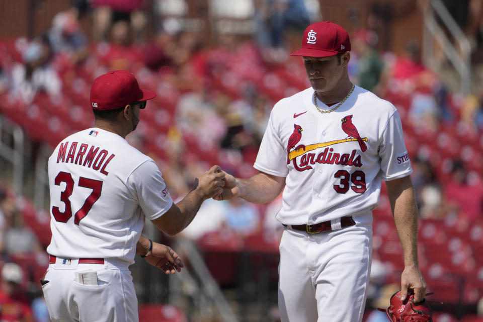 St. Louis Cardinals starting pitcher Miles Mikolas (39) is removed by manager Oliver Marmol (37) after giving up a three-run home run to Milwaukee Brewers' Victor Caratini during the sixth inning of a baseball game Thursday, Sept. 21, 2023, in St. Louis. (AP Photo/Jeff Roberson)