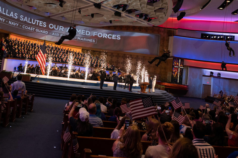 Congregants wave small flags at an annual Freedom Sunday service at the First Baptist evangelical Southern Baptist megachurch in Dallas.