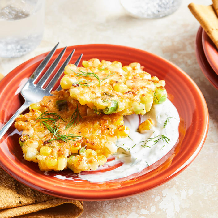 <p>This healthier version of classic corn fritters uses less oil for frying but still packs plenty of fresh corn flavor. A creamy dill sauce on the side brightens up each bite. <a href="https://www.eatingwell.com/recipe/281407/corn-fritters-with-yogurt-dill-sauce/" rel="nofollow noopener" target="_blank" data-ylk="slk:View Recipe" class="link ">View Recipe</a></p>