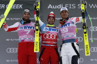 Switzerland's Beat Feuz, center, poses with France's Johan Clarey, right, and Austria's Vincent Kriechmayr, after winning the men's World Cup downhill skiing race Saturday, Dec. 7, 2019, in Beaver Creek, Colo. Clarey and Kreichmayr tied for second place in the event. (AP Photo/John Locher)