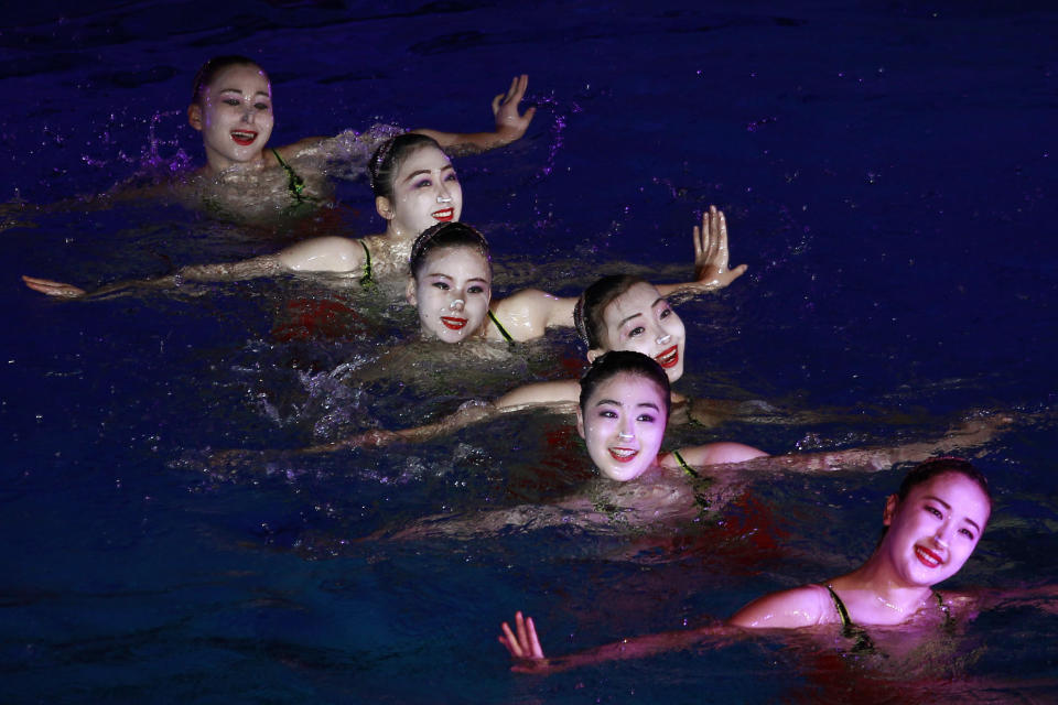 A group of synchronized swimmers perform celebrating the Day of Shining Star on the occasion of the 80th birth anniversary of former North Korean leader Kim Jong Il at the swimming gymnasium in Pyongyang, North Korea, Sunday, Feb. 13, 2022. (AP Photo/Cha Song Ho)