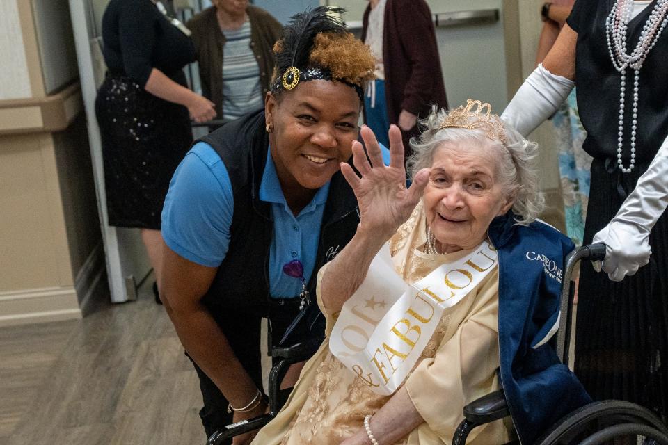 Audrey Morgan (left) and Rosemarie Menzies pose for a photo as Menzies celebrates her 100th birthday with a Great Gatsby themed party at Harmony Village at CareOne Paramus on Friday, August 11, 2023.