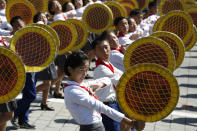 A girl reacts during a parade marking the 70th anniversary of North Korea's founding day in Pyongyang, North Korea, Sunday, Sept. 9, 2018. North Korea staged a major military parade, huge rallies and will revive its iconic mass games on Sunday to mark its 70th anniversary as a nation. (AP Photo/Ng Han Guan)