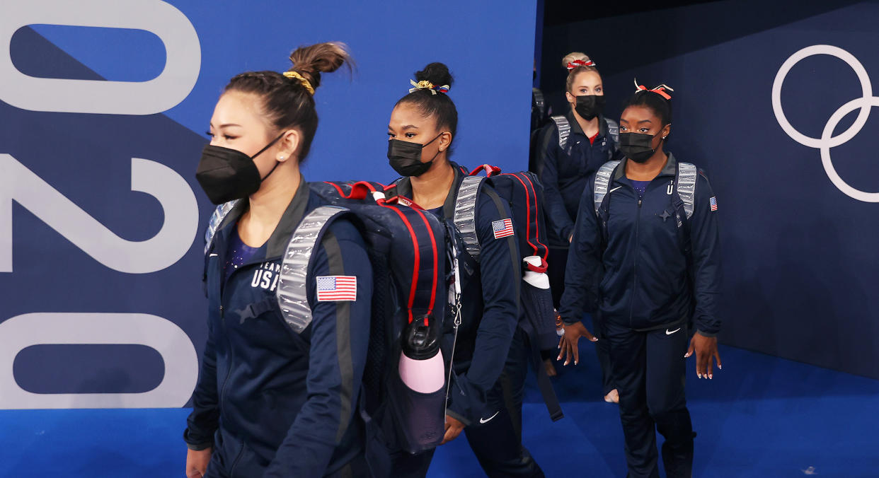 Team USA enter the arena wearing face masks on day two of the Tokyo 2020 Olympic Games at Ariake Gymnastics Centre (Laurence Griffiths / Getty Images)