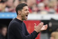 Leverkusen's head coach Xabi Alonso reacts during a German Bundesliga soccer match between Bayer Leverkusen and Werder Bremen in Leverkusen, Germany, Sunday, April 14, 2024. (AP Photo/Martin Meissner)