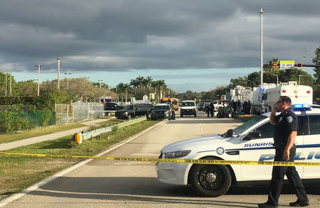 Police patrol the area outside Marjory Stoneman Douglas High School following a school shooting incident in Parkland, Florida, U.S., February 15, 2018. REUTERS/Zachary Fagenson