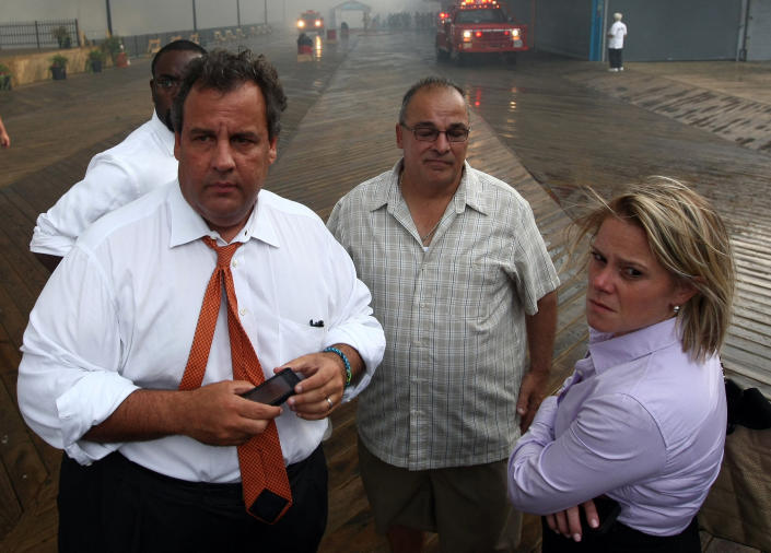 In this Sept. 12, 2013 photo provided by the Office of the Governor of New Jersey, Deputy Chief of Staff Bridget Anne Kelly, right, stands with Gov. Chris Christie, left, during a tour of the Seaside Heights, N.J. boardwalk after it was hit by a massive fire. Christie fired Kelly Thursday, Jan. 9, 2014, and apologized over and over for his staff's stupid behavior, insisting during a nearly two-hour news conference that he had no idea anyone around him had engineered traffic jams as part of a political vendetta against a Democratic mayor. (Office of Gov. Chris Christie, Tim Larsen/AP/Photo)