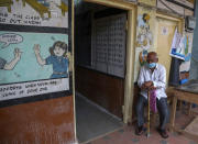 An elderly man waits to get inoculated during a special vaccination drive against COVID-19 in Hyderabad, India, Saturday, July 24, 2021. (AP Photo/Mahesh Kumar A.)