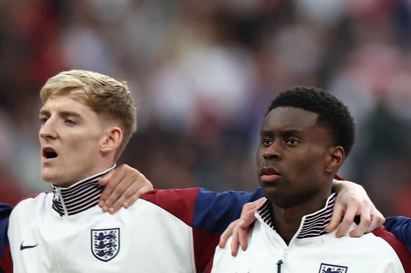 England midfielder #11 Anthony Gordon and defender #06 Marc Guehi line up against Iceland